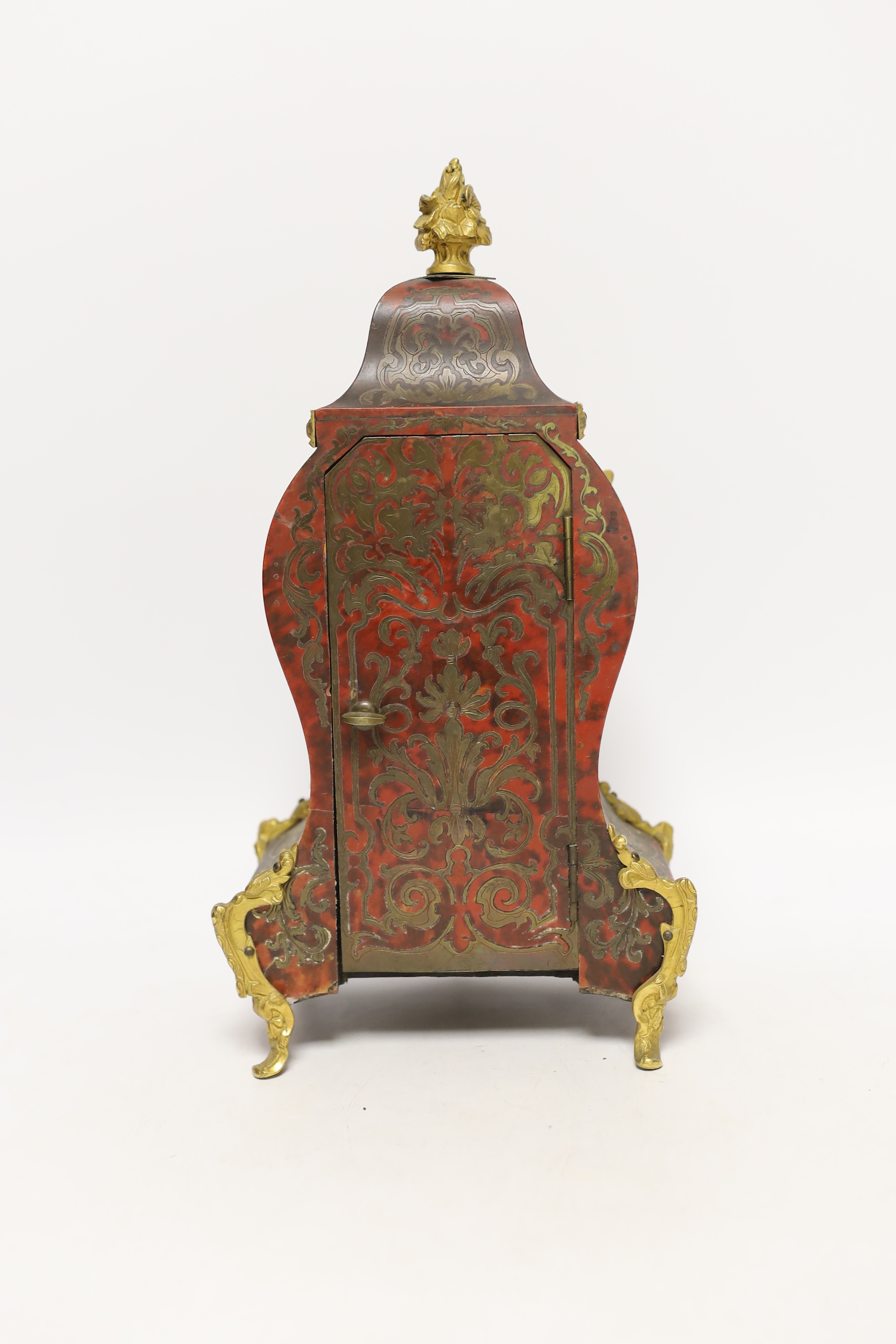 A late 19th century red boulle work tortoiseshell mantel clock, white enamel dial and numerals, Aubert Klaftenberger Geneva, with keys and pendulum, 30cm